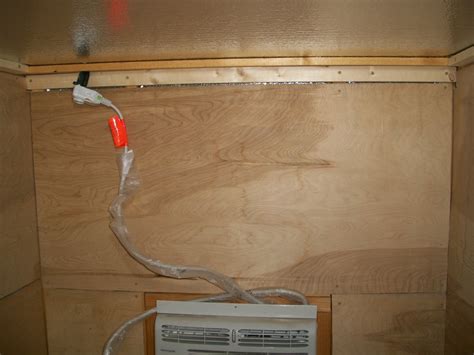 running extension cord through exterior wall